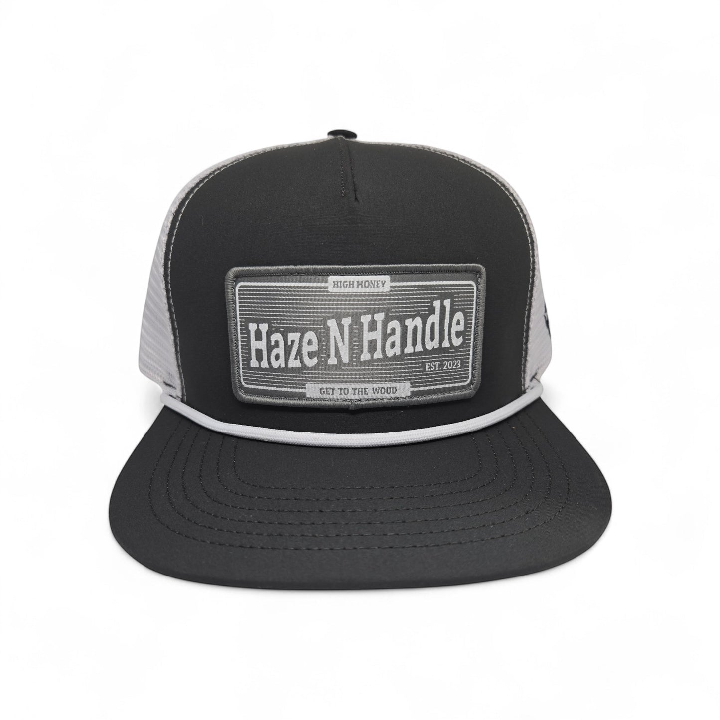 Haze N Handle black and gray trucker cap with rope detail and woven patch. Adjustable back.
