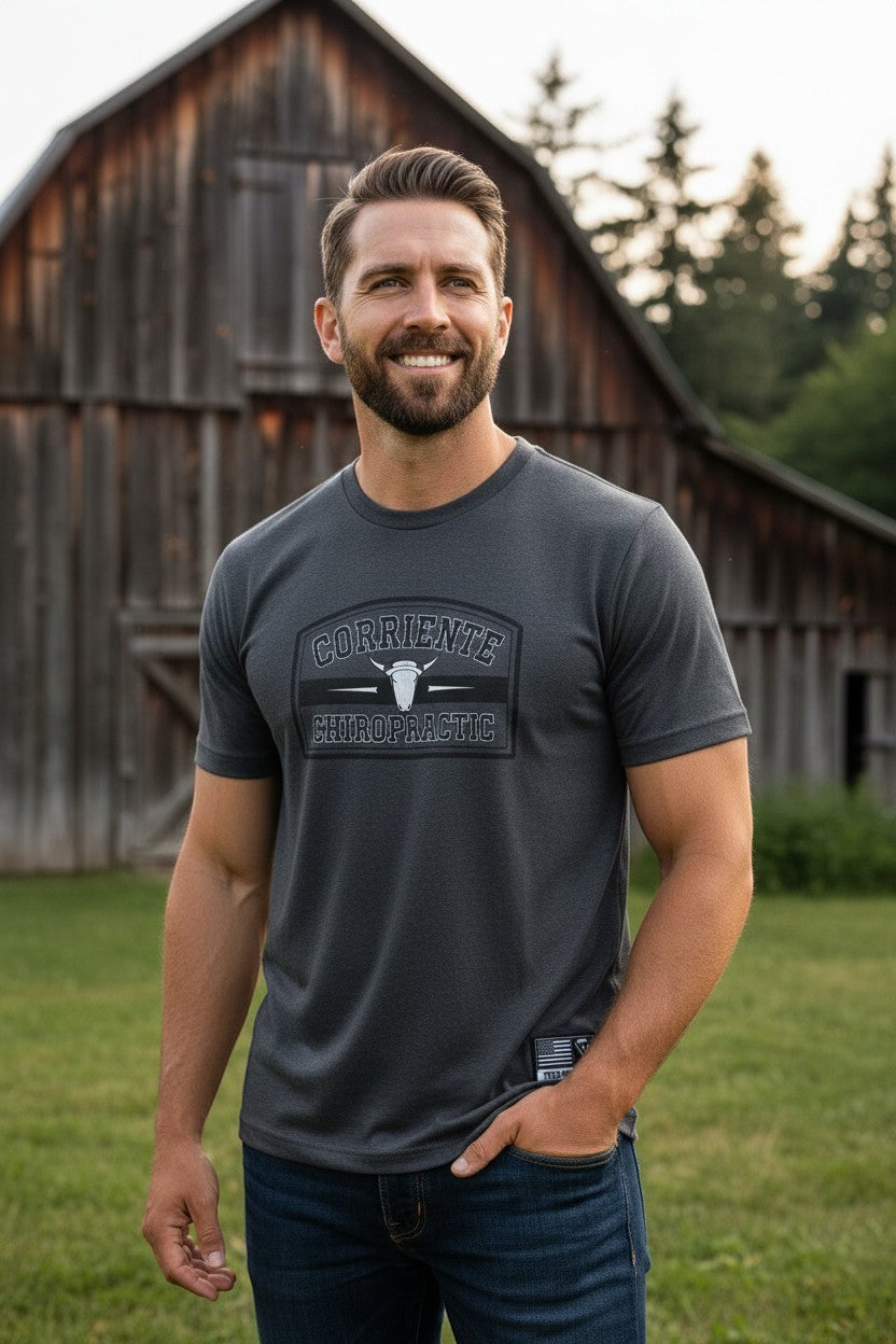 Haze N Handle charcoal grey short-sleeve t-shirt with "Corriente Chiropractic" graphic and bull skull emblem.