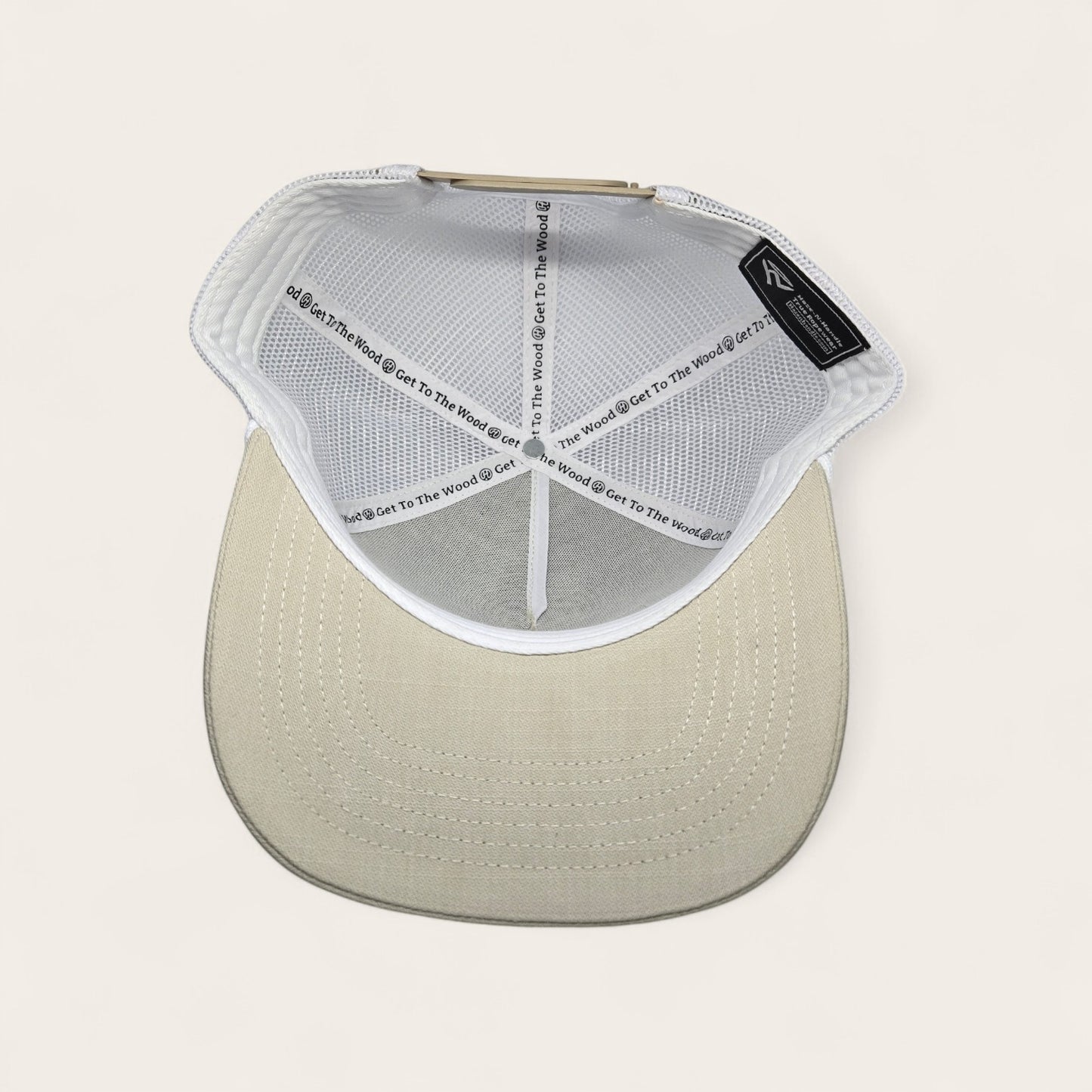 Haze N Handle stone trucker hat with white mesh back and embroidered patch. Adjustable snapback for a comfortable fit.