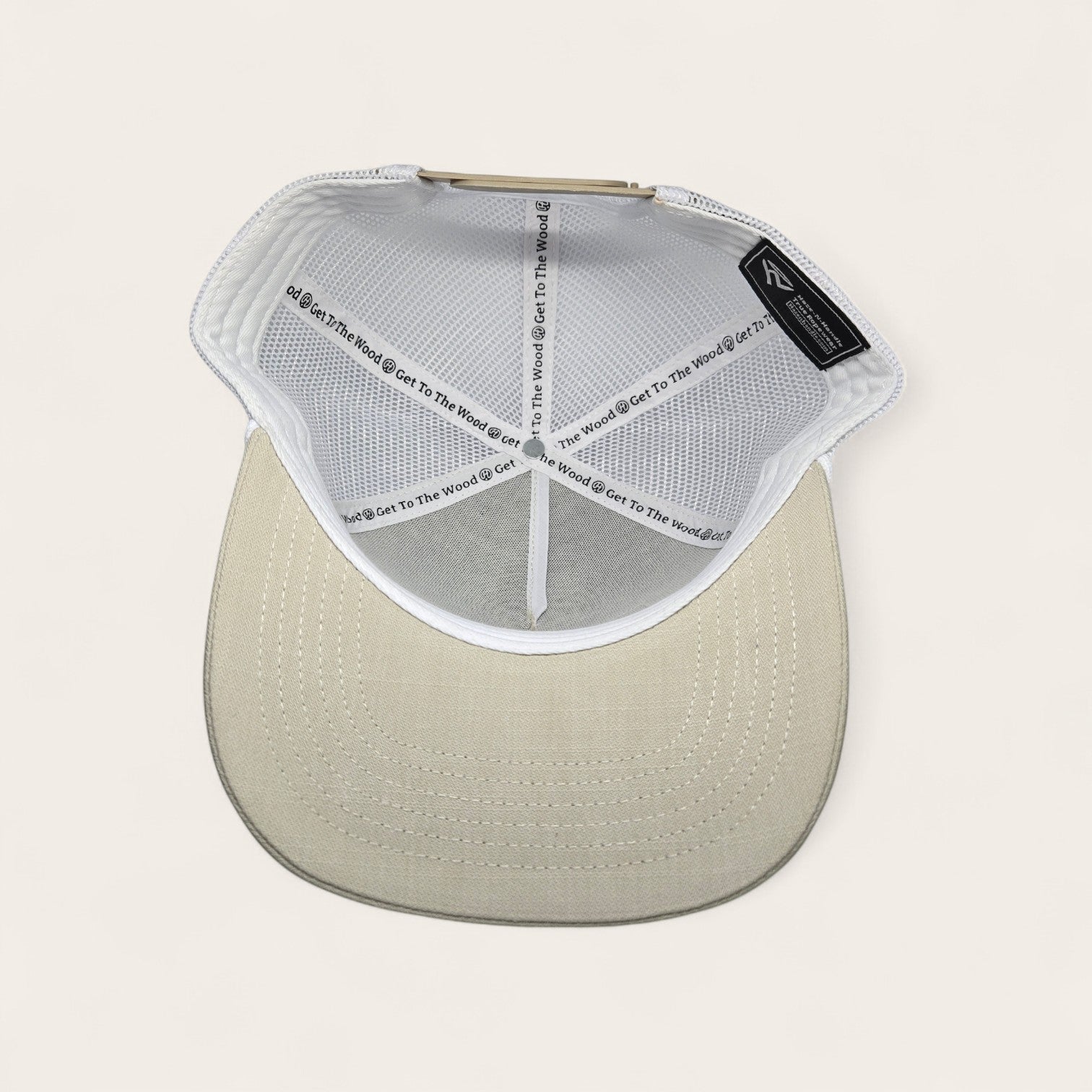 Haze N Handle stone trucker hat with white mesh back and embroidered patch. Adjustable snapback for a comfortable fit.