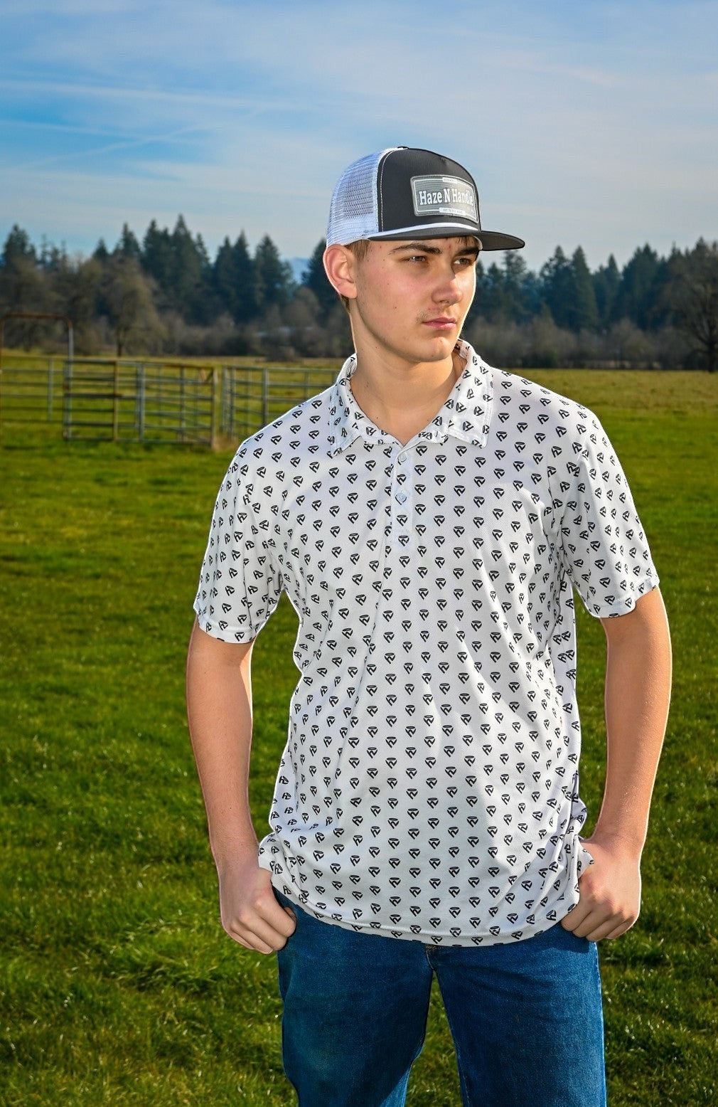 Haze N Handle unisex white short-sleeve polo with all-over black icon print, classic collar, and button placket.